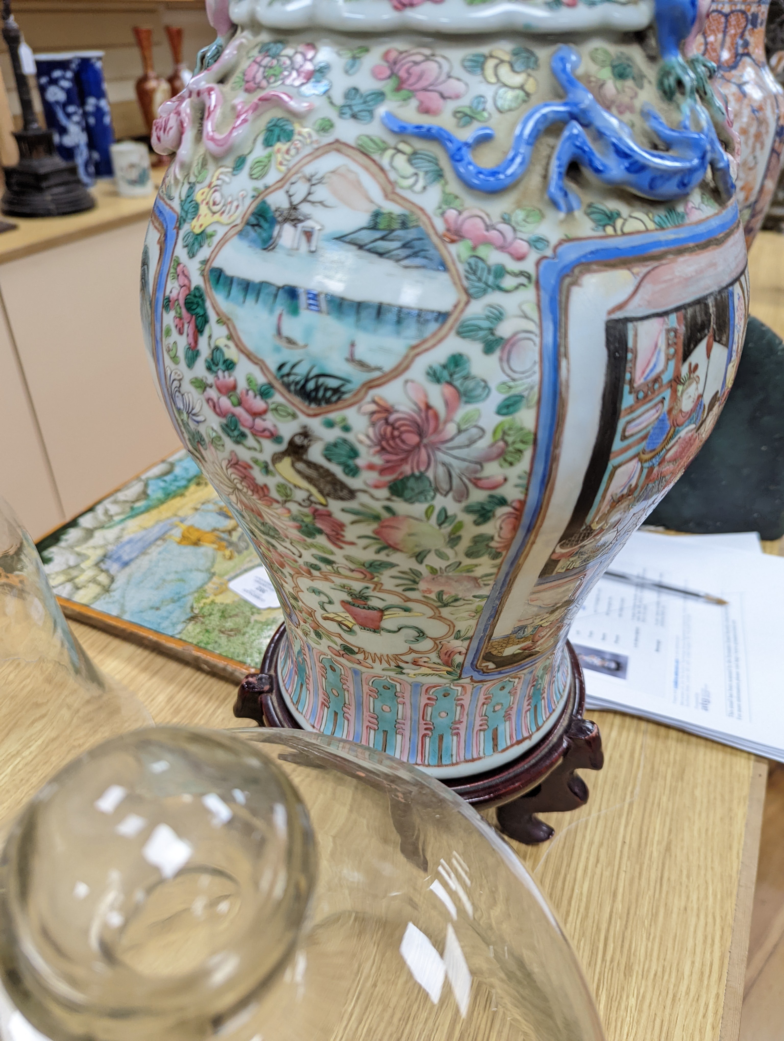A large Chinese famille rose two handled vase, late 19th century, wood stand, restored 54cm incl stand